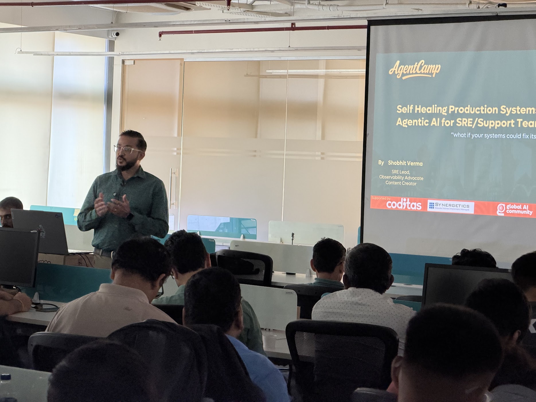 Shobhit Verma speaking at AgentCamp